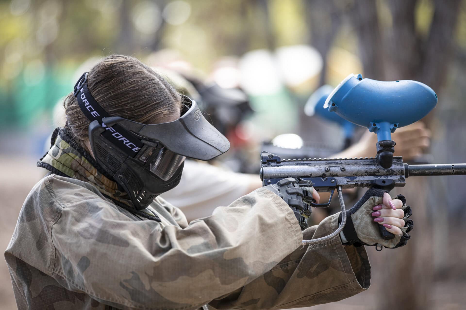 Paintball player taking aim