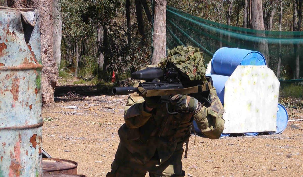 Paintball player aiming